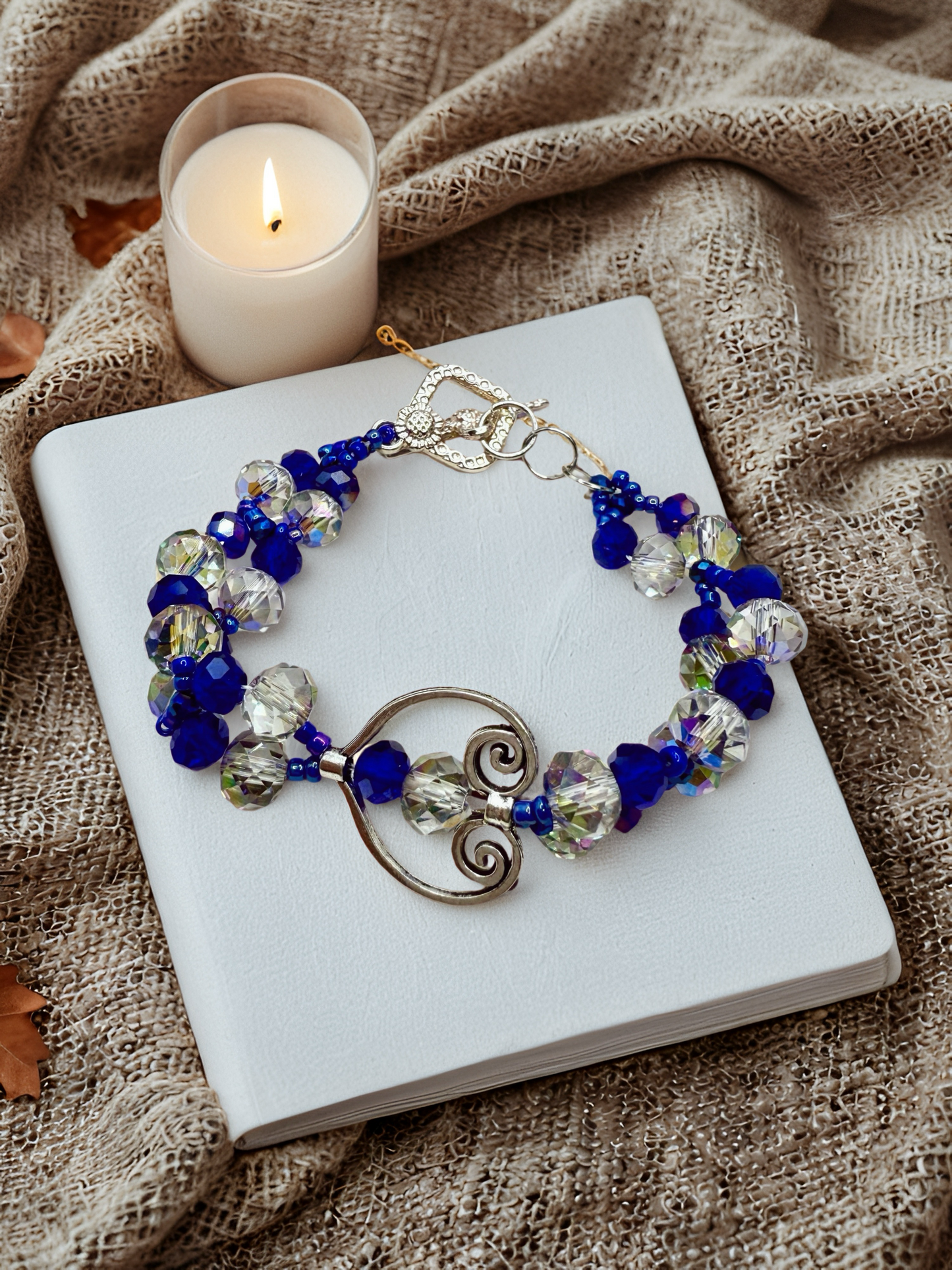 Crystal blue glass beads with antique hollow heart charms