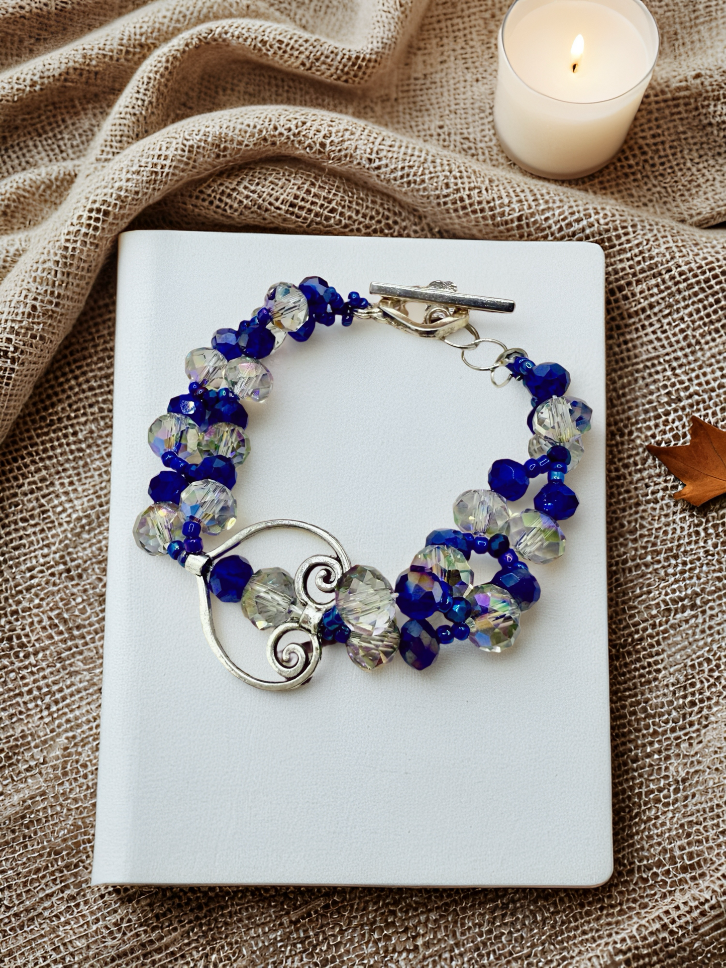 Crystal blue glass beads with antique hollow heart charms