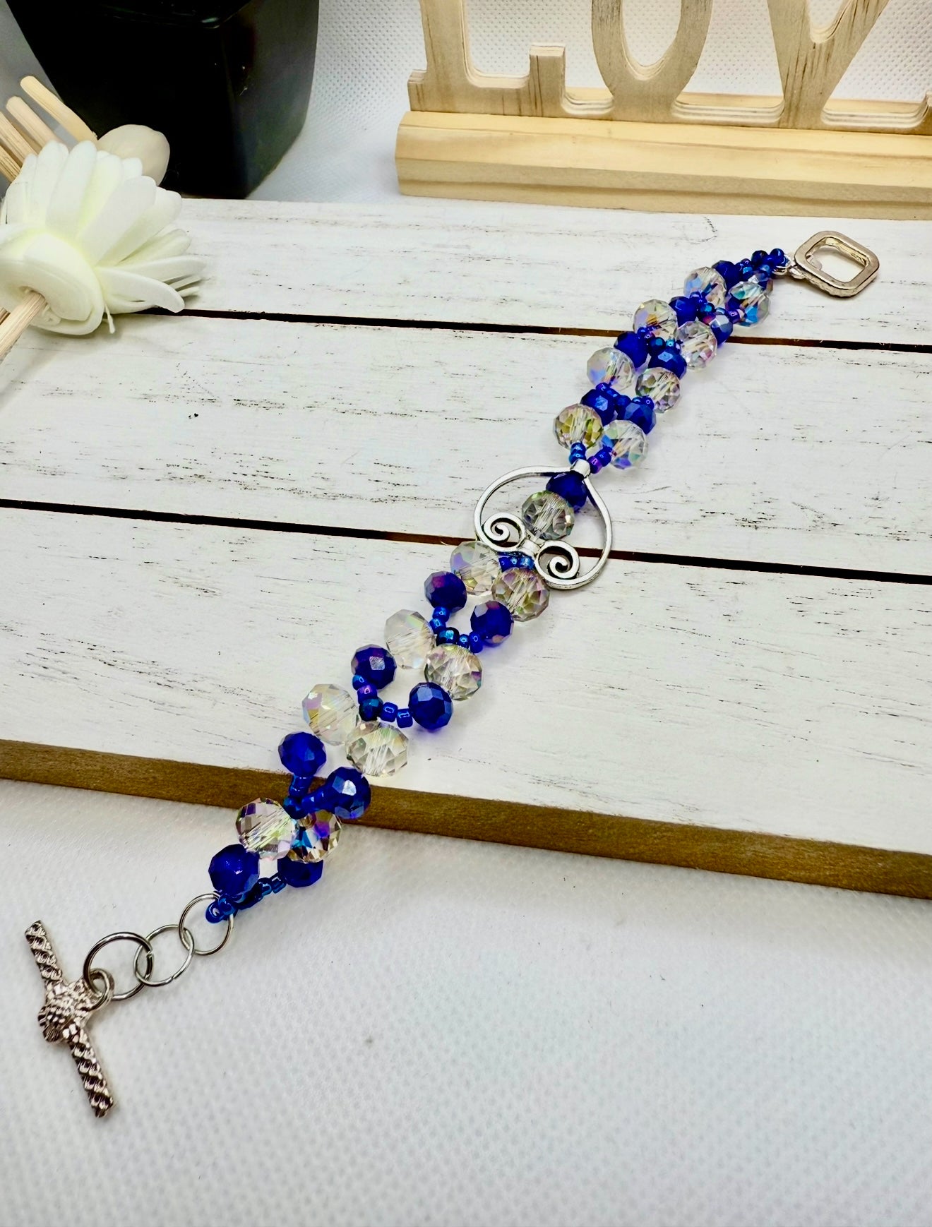 Crystal blue glass beads with antique hollow heart charms