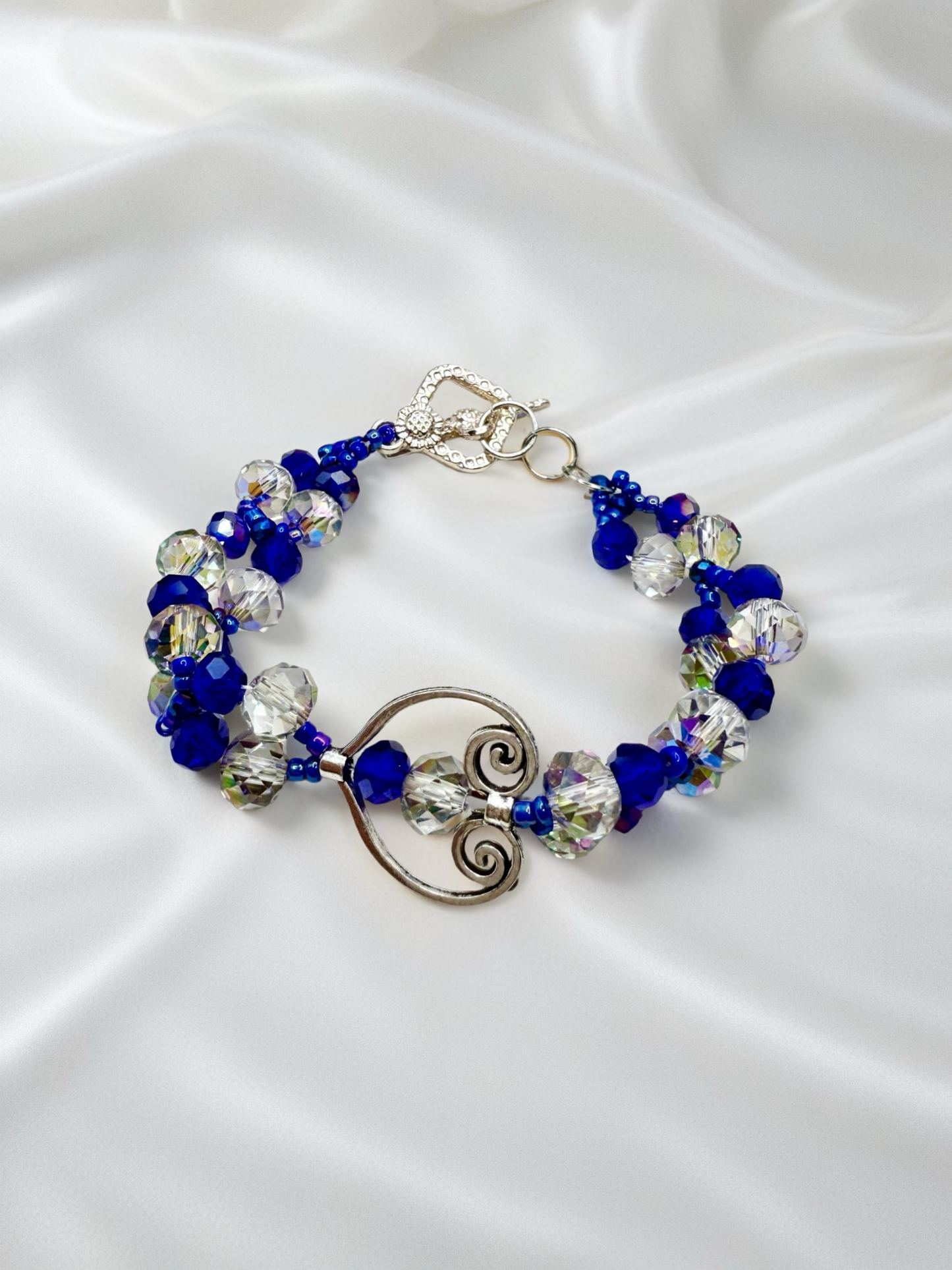 Crystal blue glass beads with antique hollow heart charms