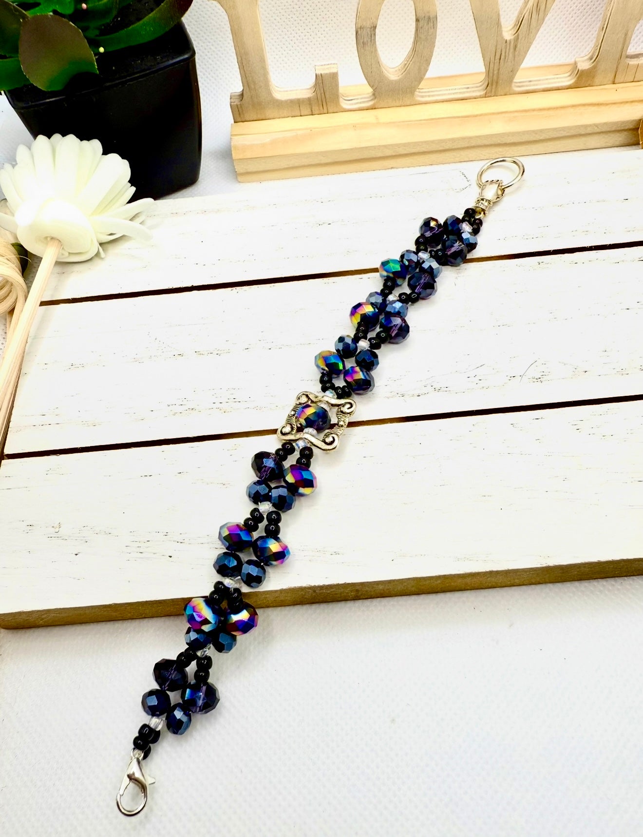 Beauty in Black glass beads with antique hand charms