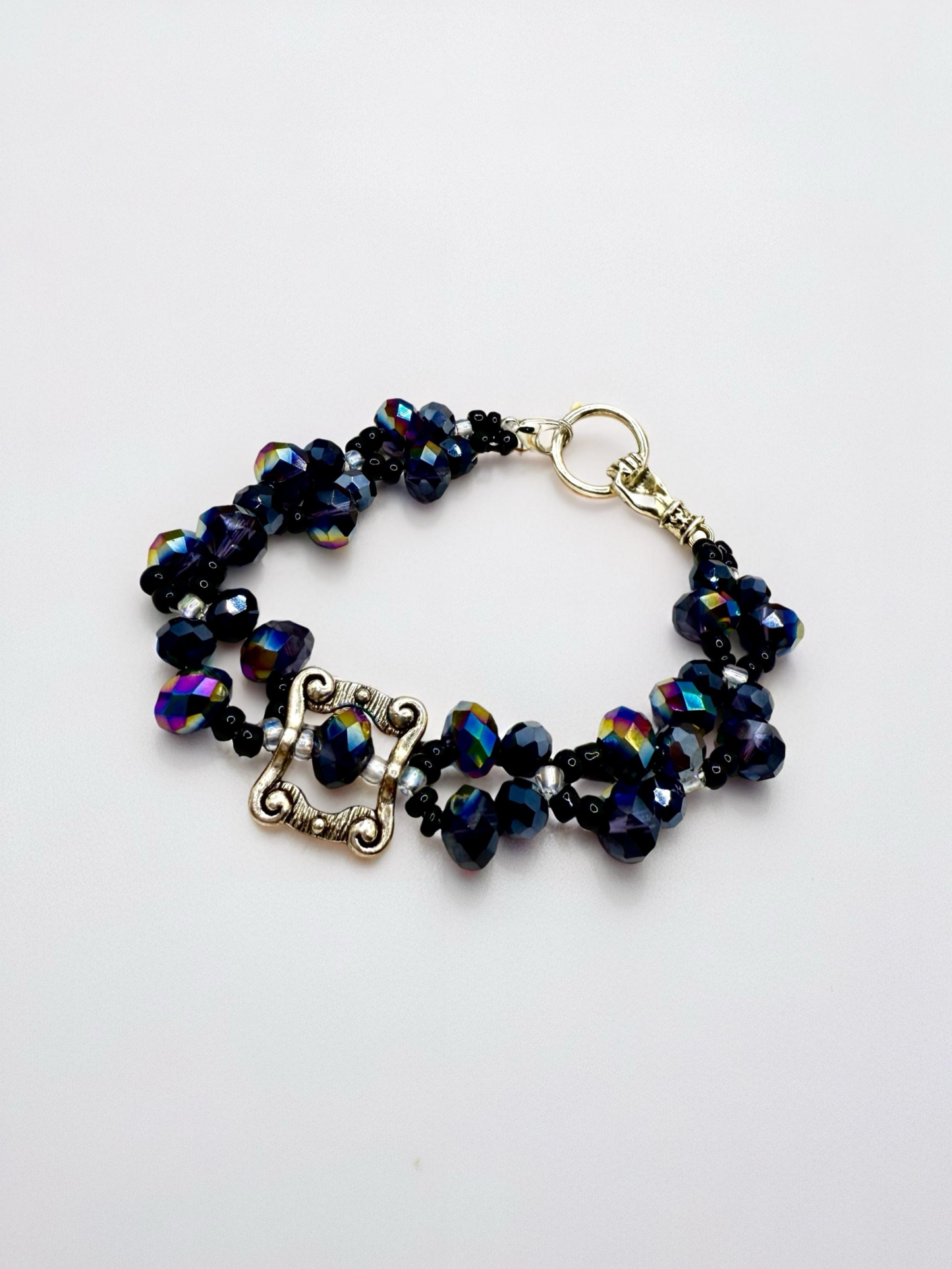 Beauty in Black glass beads with antique hand charms