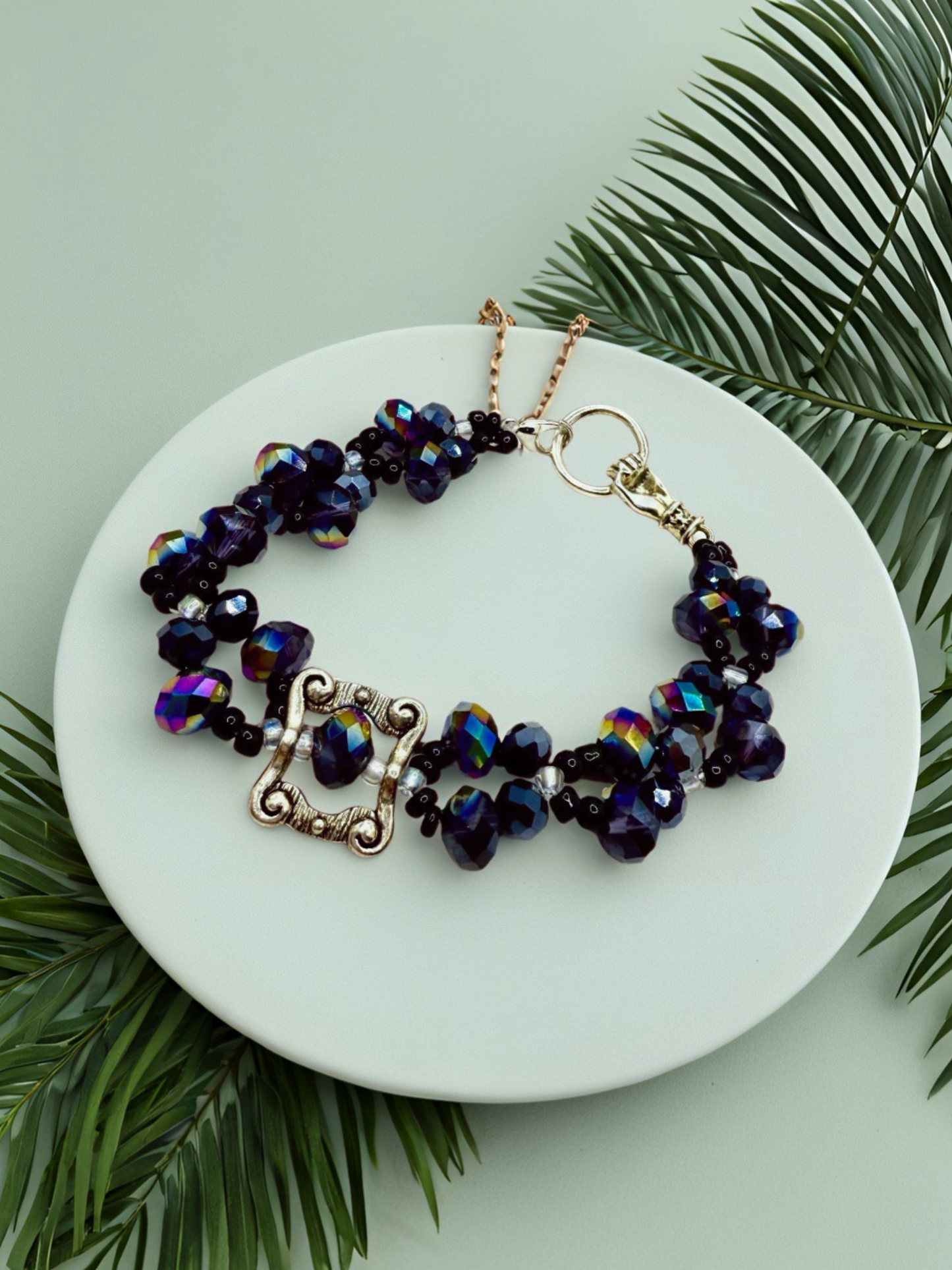 Beauty in Black glass beads with antique hand charms