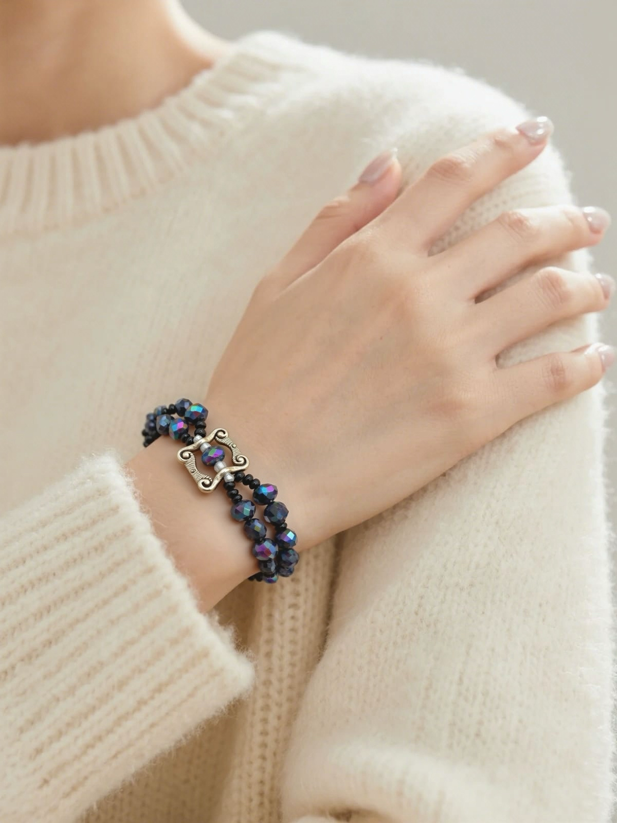 Beauty in Black glass beads with antique hand charms