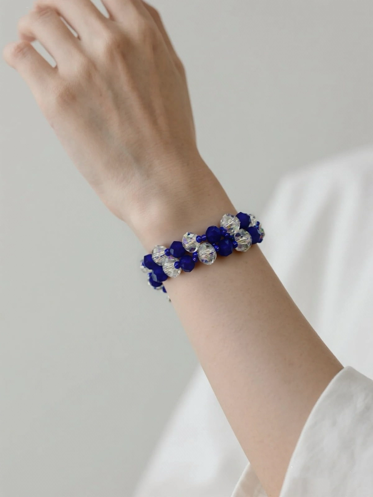 Crystal blue glass beads with antique hollow heart charms