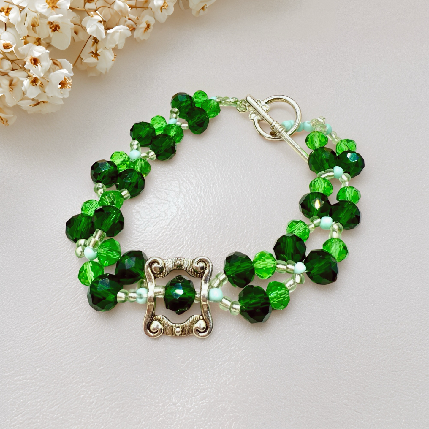 Green Faceted glass beads with antique hollow square charm