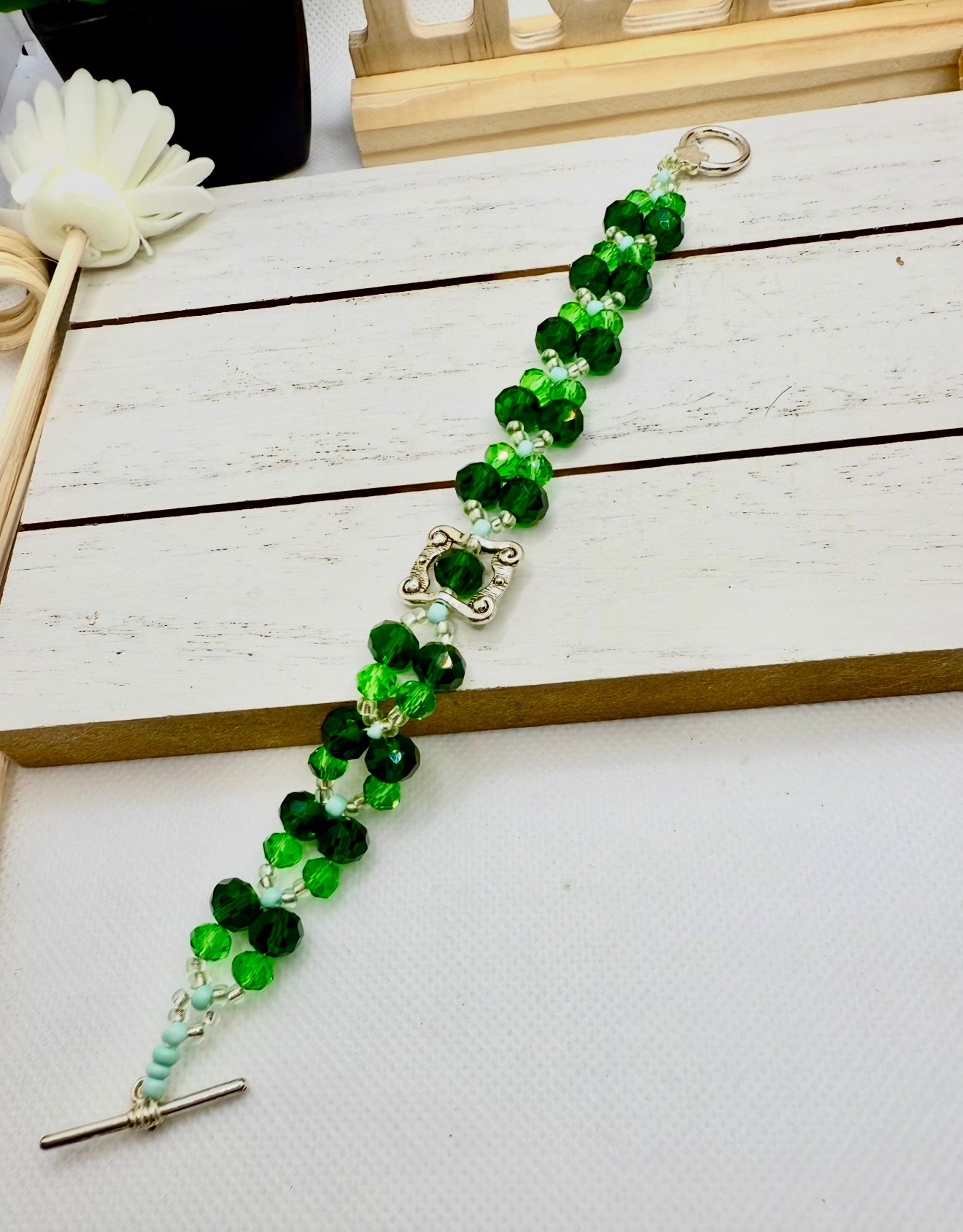 Green Faceted glass beads with antique hollow square charm
