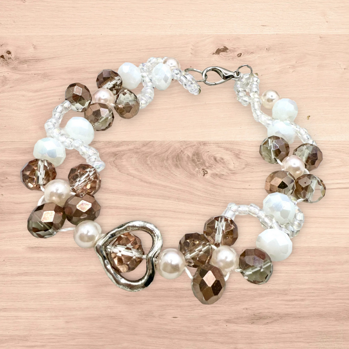 Champagne in white glass beads with hollow heart charms