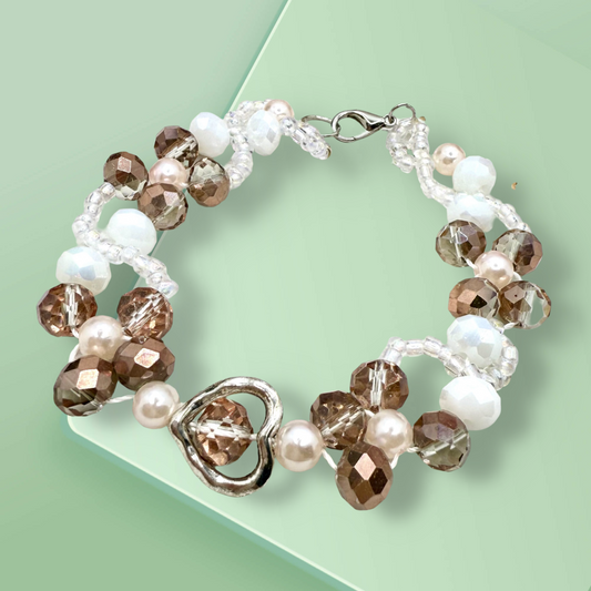 Champagne in white glass beads with hollow heart charms