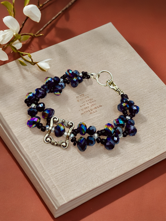 Beauty in Black glass beads with antique hand charms